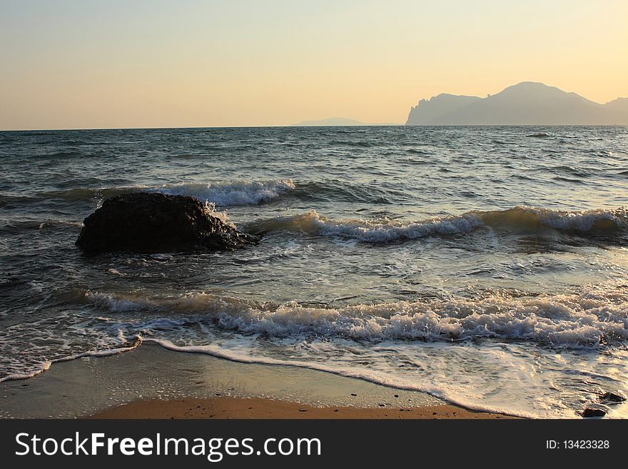 Evening beach - beautiful waves at sunset. Evening beach - beautiful waves at sunset