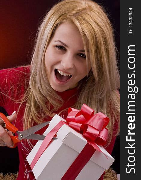 Girl holding a gift and smiling. Girl holding a gift and smiling
