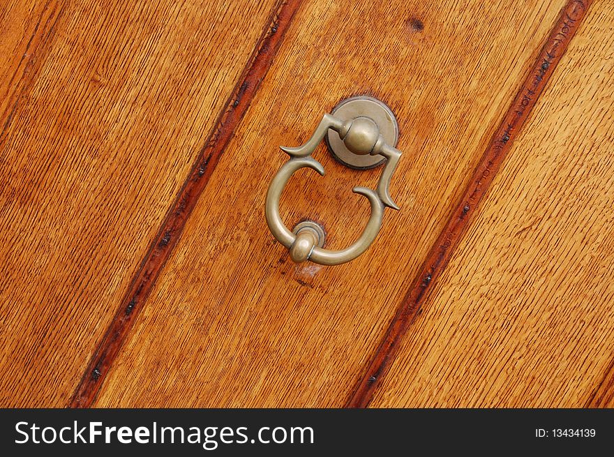 Brown wooden door in Amsterdam city