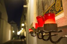 Red Candles Attached To Little Altar At Night, Cordoba, Spain Royalty Free Stock Photo