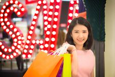 Young Woman Holding Fashion Shopping Bag In Mall Royalty Free Stock Image
