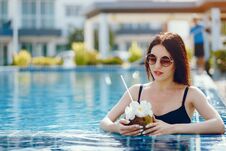 Brunette Girl Drinking Coconut Juice Royalty Free Stock Photography