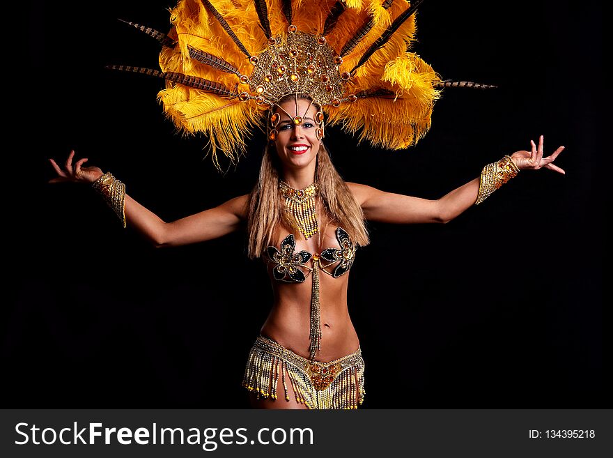 Brazilian Woman Posing In Samba Costume Over Black Background