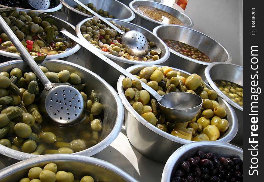 Green olives for sale on the Sunday market El Pozo in Madrid /Spain/. Green olives for sale on the Sunday market El Pozo in Madrid /Spain/