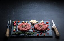 Raw Meat Burger Cutlets With Ingredients Royalty Free Stock Photography