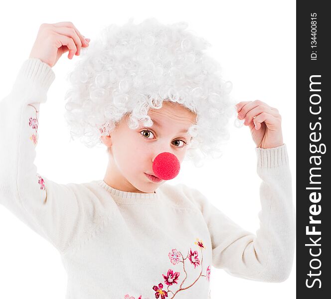 Lovely little girl in white voluminous clown wig and red nose posing in front of camera isolated on white background. Lovely little girl in white voluminous clown wig and red nose posing in front of camera isolated on white background