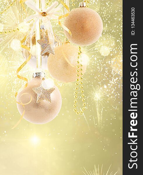 Hanging golden christmas balls row on golden bokeh background with copy space. Hanging golden christmas balls row on golden bokeh background with copy space