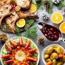 Christmas Dinner With Roasted Meat Steak, Christmas Wreath Salad, Baked Potato, Grilled Vegetables, Cranberry Sauce Stock Image