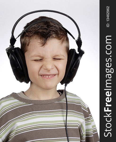 Kid with headset - eyes closed.