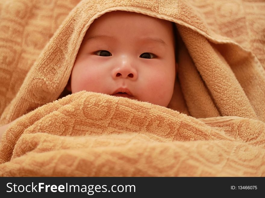 Lovely Chinese baby in the towel. Lovely Chinese baby in the towel