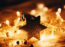 Christmas And New Year Decorations Star On Lights Background Royalty Free Stock Images