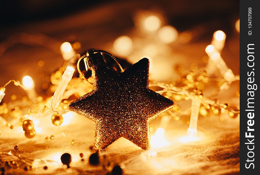 Christmas And New Year Decorations Star On Lights Background