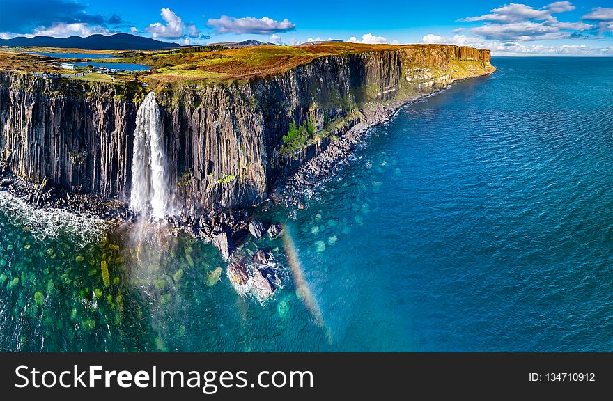 Aerial view of the dramatic coastline at the cliffs by Staffin with the famous Kilt Rock waterfall - Isle of Skye - Scotland.