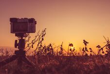 Camera Taking Picture Film Of Sunrise Stock Photo