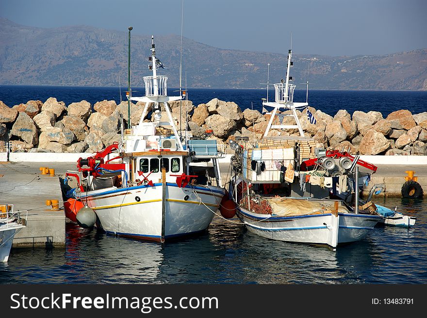 Fishing boats in a Mediterranean port.