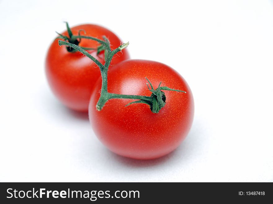 Two fresh tomato shot in a studio. Two fresh tomato shot in a studio