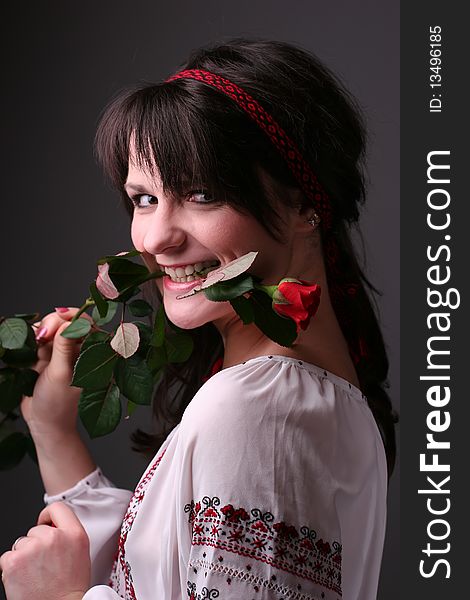 Young girl in traditional (national) ukrainian dress with a rose. Young girl in traditional (national) ukrainian dress with a rose