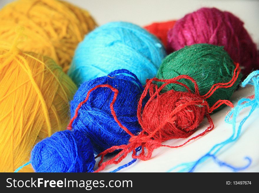 Colored yarn ball - yellow, purple, blue, red. Colored yarn ball - yellow, purple, blue, red