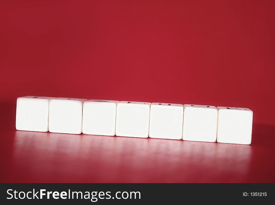 Cube with letters on a red background. Cube with letters on a red background