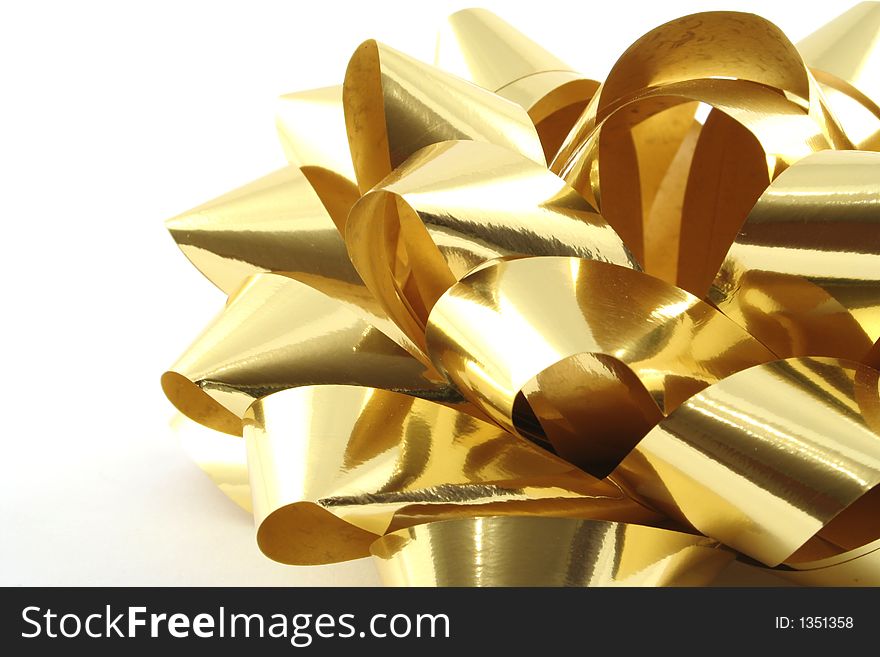 Gold gift ribbon on a white background