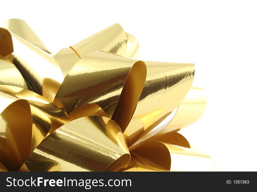 Gold gift ribbon on a white background