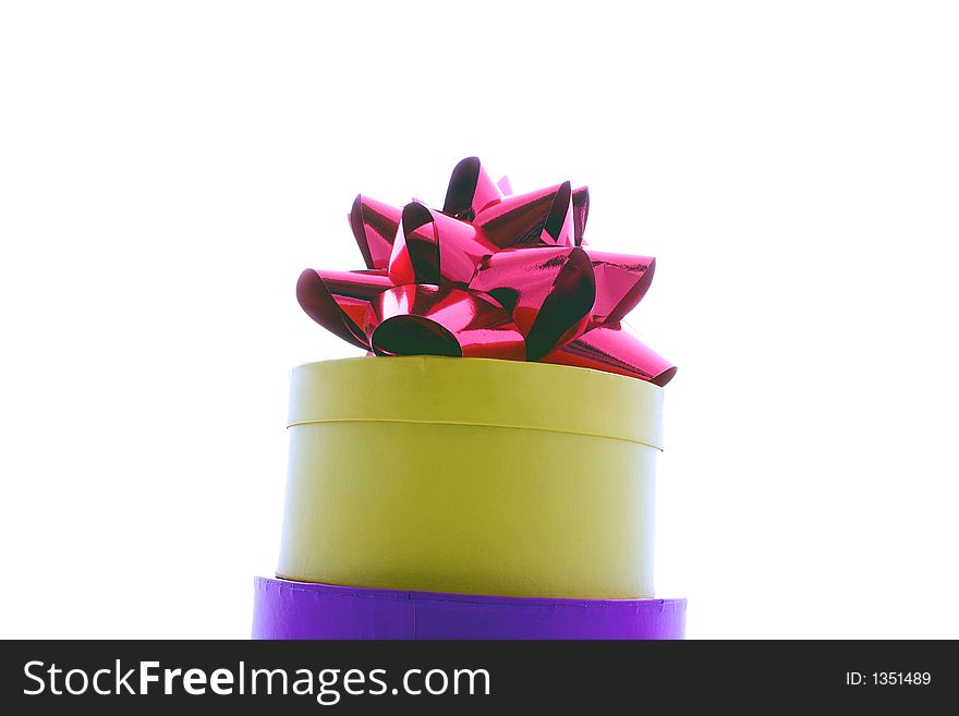 Yellow round gift box and ribbon isolated. Yellow round gift box and ribbon isolated