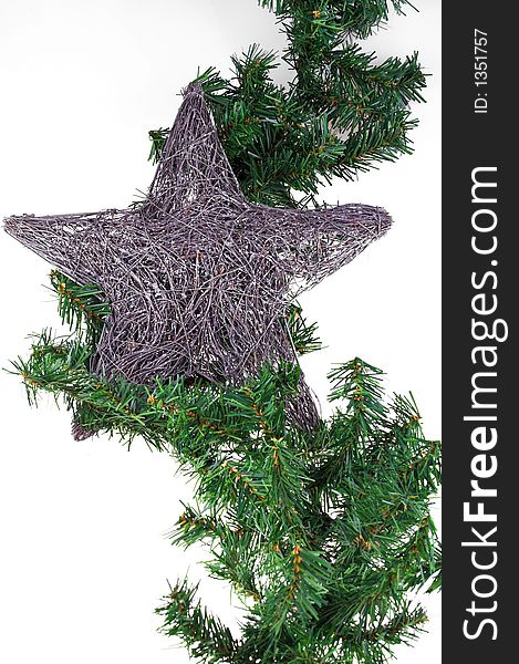 Christmas decoration pine and silver star isolated on white