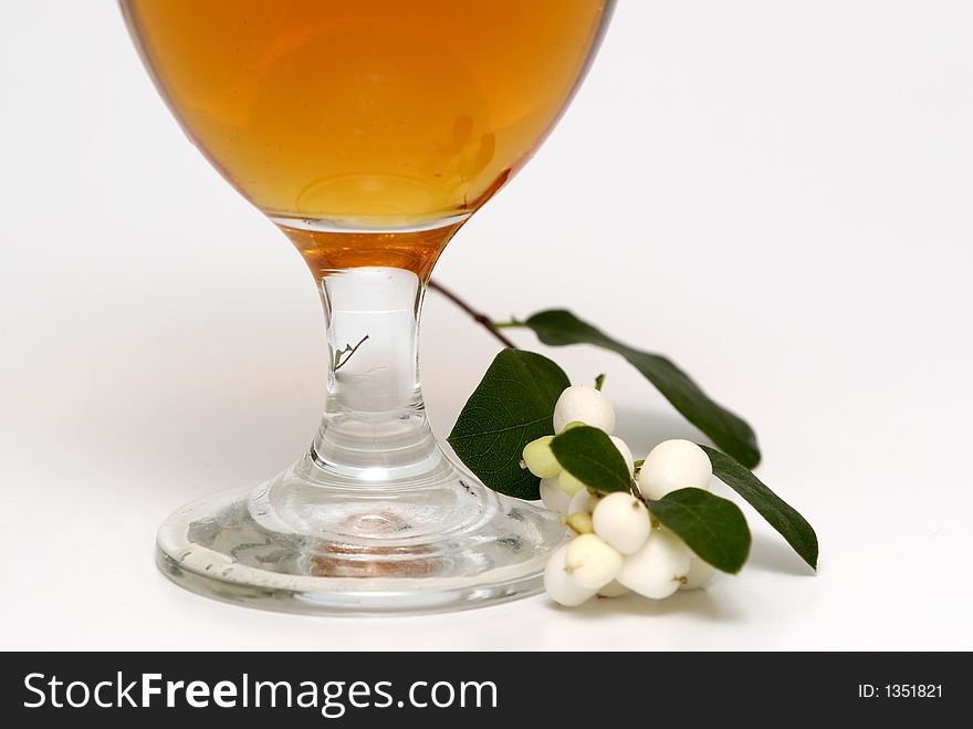 A glass of beer and some pearls