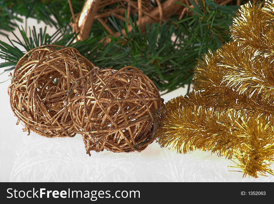 Christmas decoration gold balls on the pine with gold garland close up