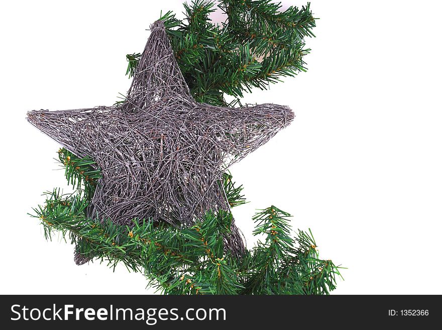 Christmas decoration with pine and silver star isolated on white