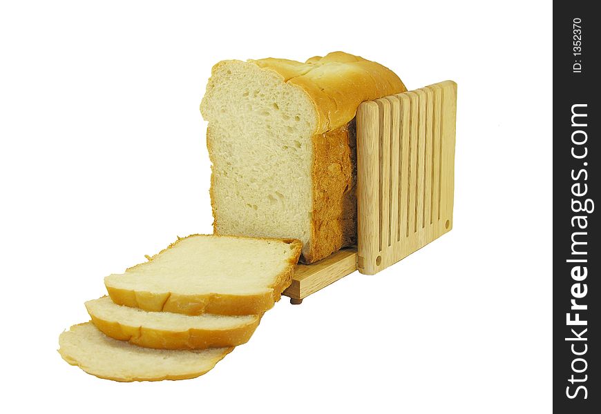Homemade sliced bread in a bread cutter.