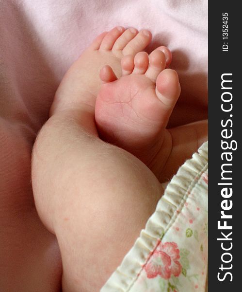 Newborn infant girl toes and feet. Newborn infant girl toes and feet