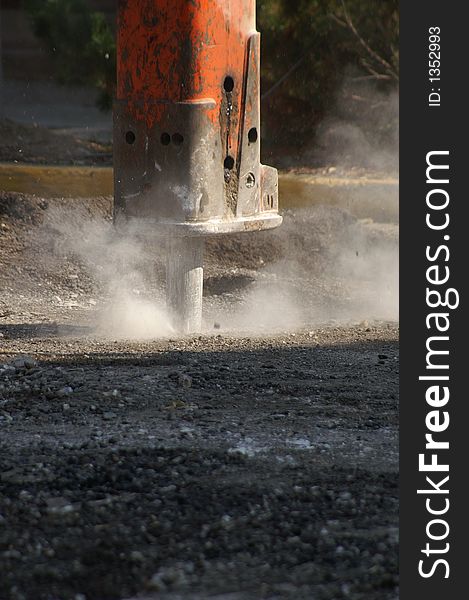 Hydraulic heavy-duty construction punch used to break up roadways.