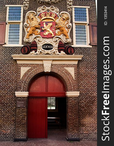 Coat of arms with golden lions sits above the entrance to an old powder magazine. Coat of arms with golden lions sits above the entrance to an old powder magazine