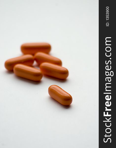 Orange medicines on a table