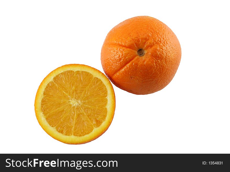 An orange sliced in half next to a whole orange. An orange sliced in half next to a whole orange