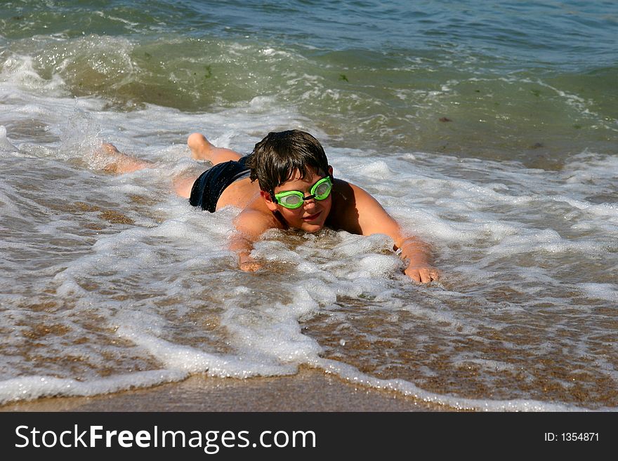 The teenager swimming in the sea