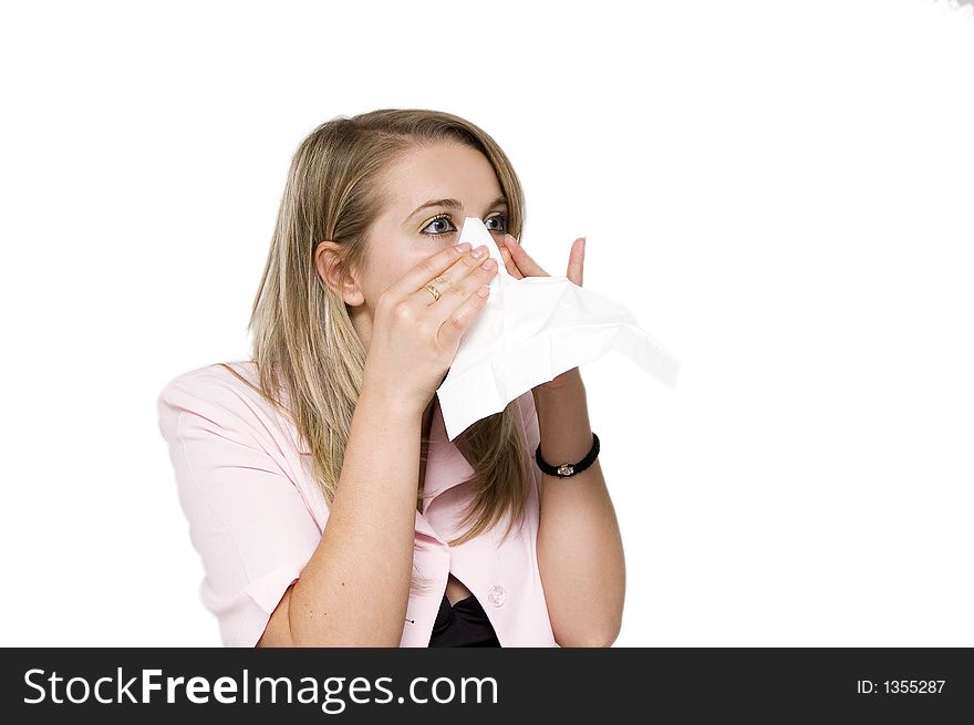 Closeup of a crying woman with a soft paper. isoalated on white