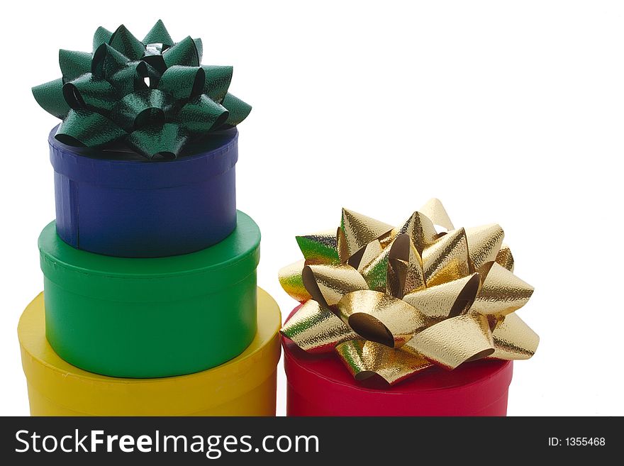 Assorted stacked gift boxes and ribbons isolated. Assorted stacked gift boxes and ribbons isolated