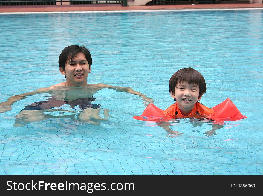 Man & Boy In The Pool