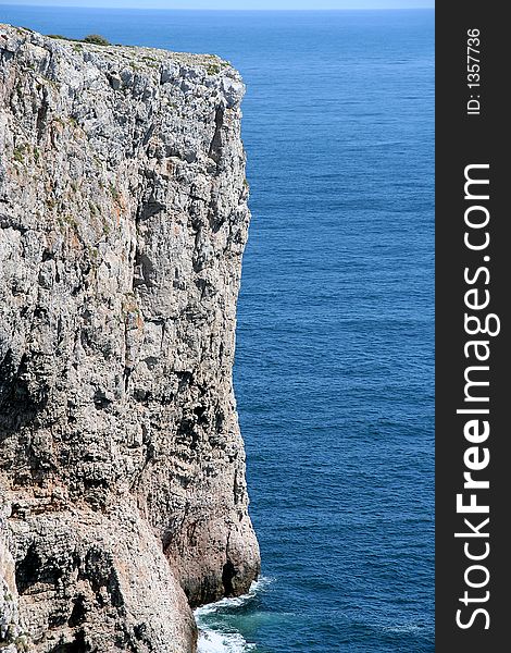 A very cliffy rock at the end of the world - the cabo de sao vicente. This ist the southern coastline of Portugal