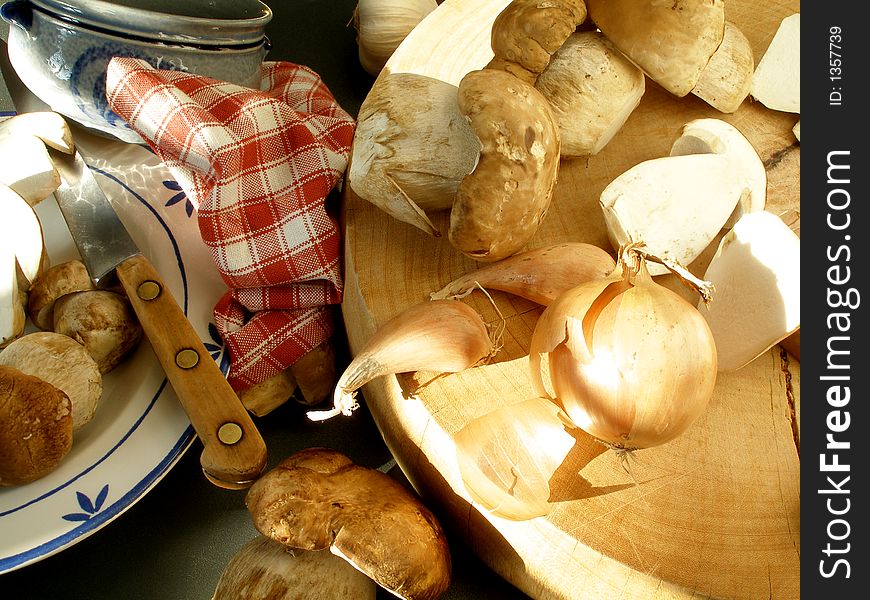 Wild mushrooms  in the sunset to be cleaned. Wild mushrooms  in the sunset to be cleaned