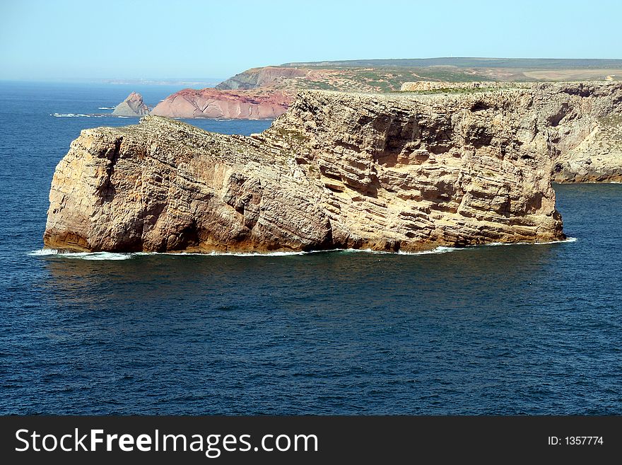 A huge rock in the atlantic ocean at the western coastline of portugal - looks like a shoe. A huge rock in the atlantic ocean at the western coastline of portugal - looks like a shoe...