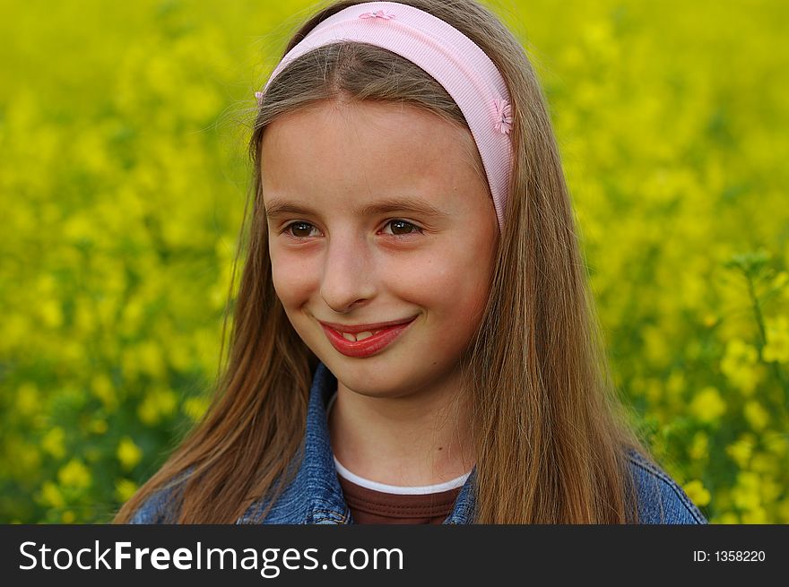 Portrait of young girl in yellow flowers