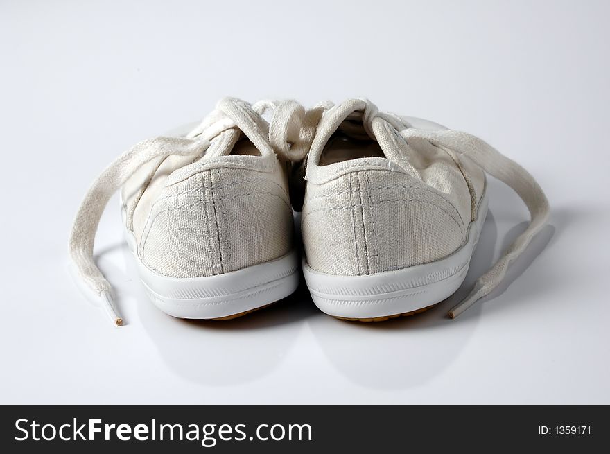 Baby Shoes seen from behind over a white background. Baby Shoes seen from behind over a white background