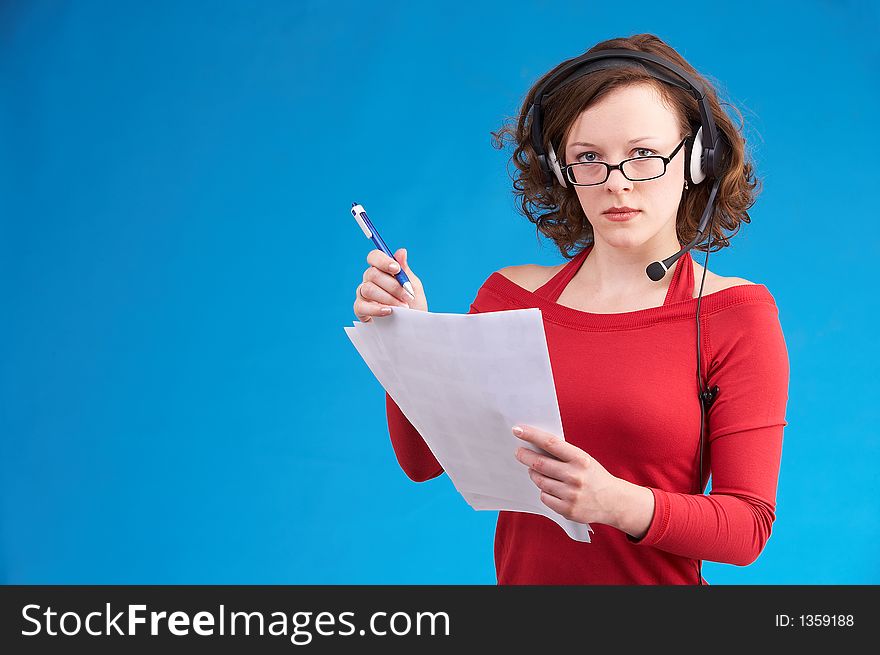 Young businesswoman in red dress on blue background. Young businesswoman in red dress on blue background