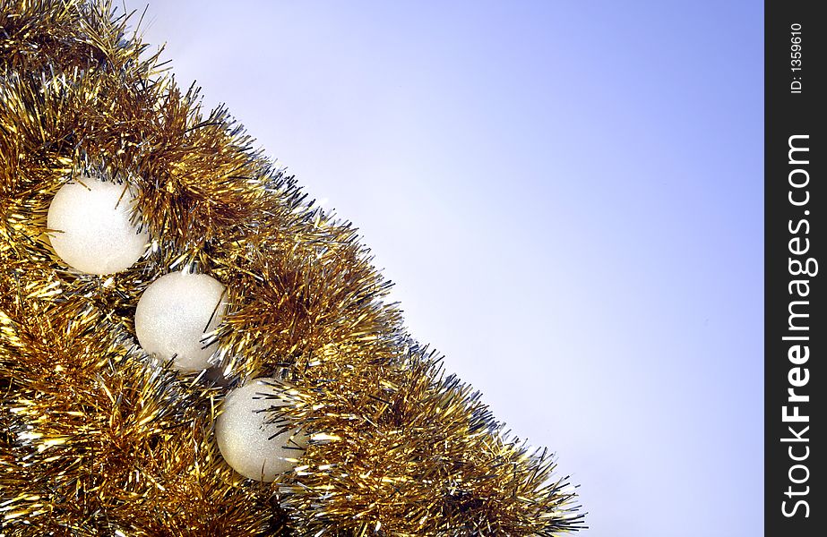 Christmas tinsel on blue background