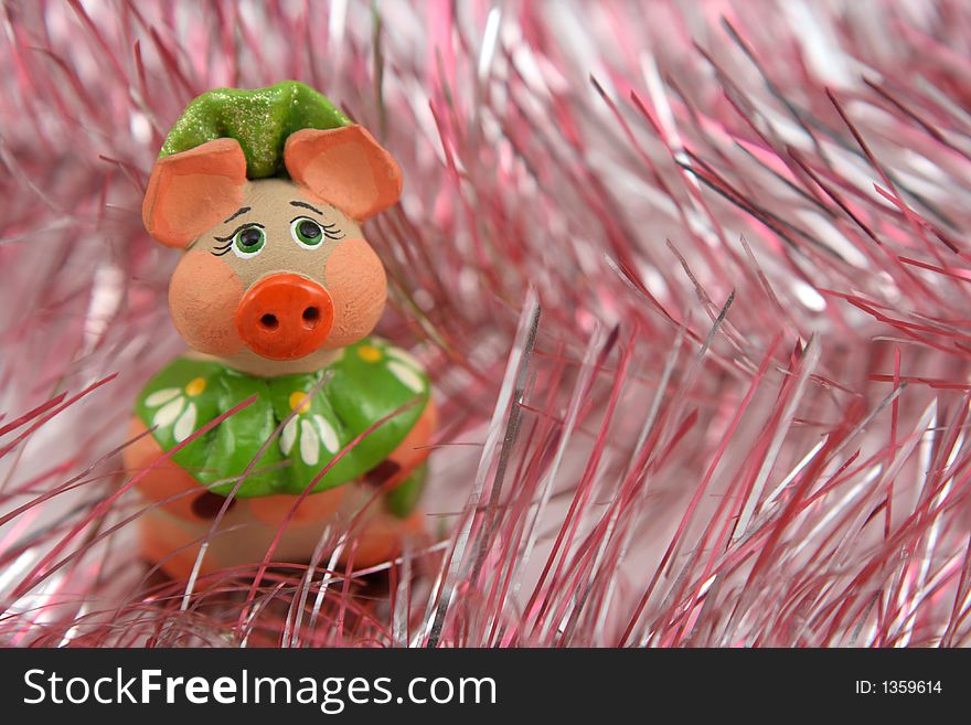 Piggy on christmas tinsel background