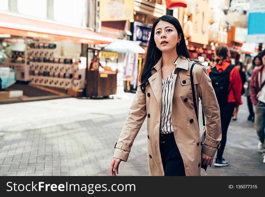 Woman In Casual Suit Walking In Dotonbori