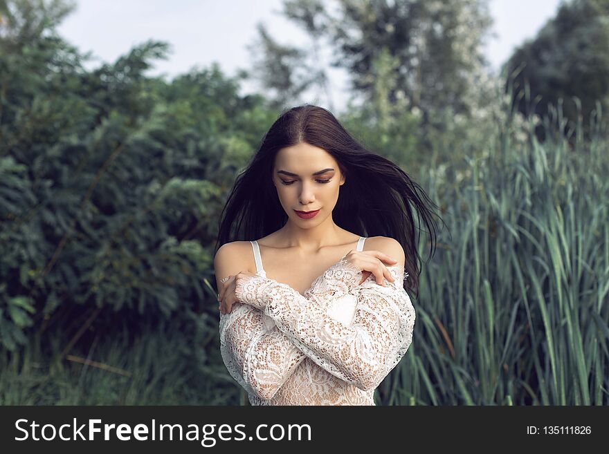 The girl in the summer forest near the river. The girl in the summer forest near the river